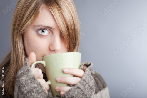 Young woman drinking coffee