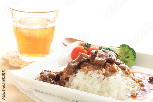  Homemade beef stew on rice with iced tea