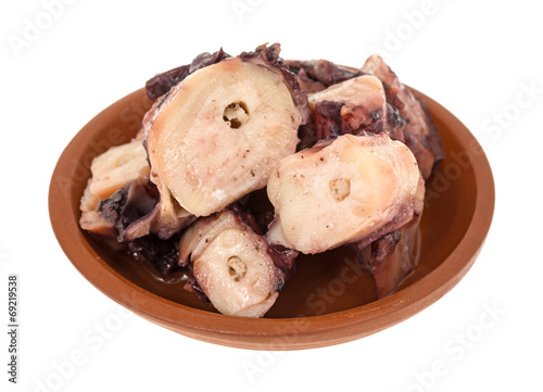 Small serving of cooked octopus in garlic sauce