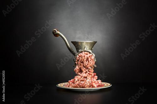 Obraz na plátně Meat grinder on a black background