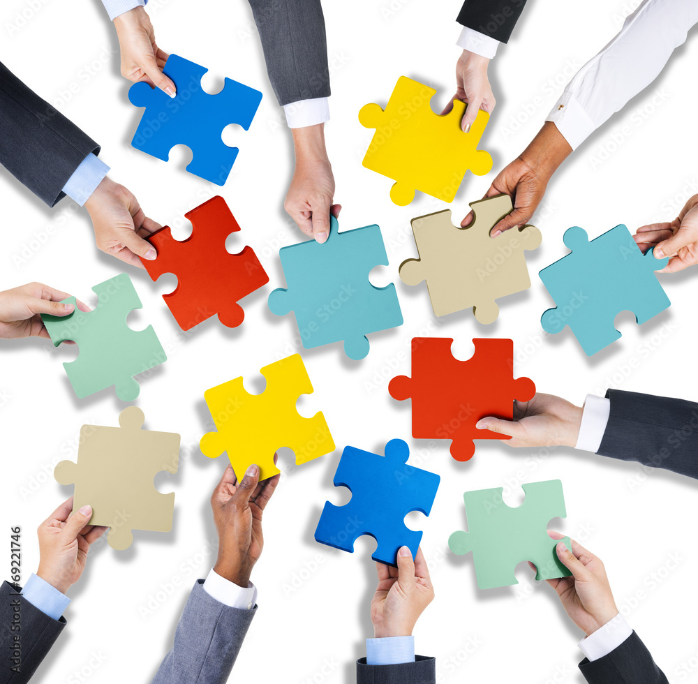 Group of Business Hands Holding Jigsaw Puzzles Group of Business Hands Holding Jigsaw Puzzles