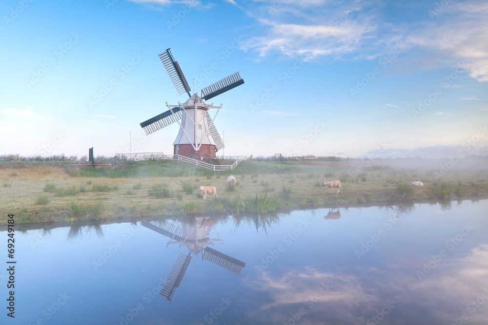 Dutch windmill in misty morning