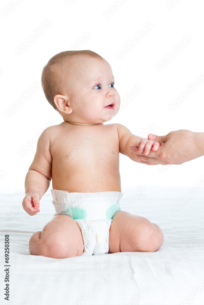 mother supporting baby by hands mother supporting baby by hands