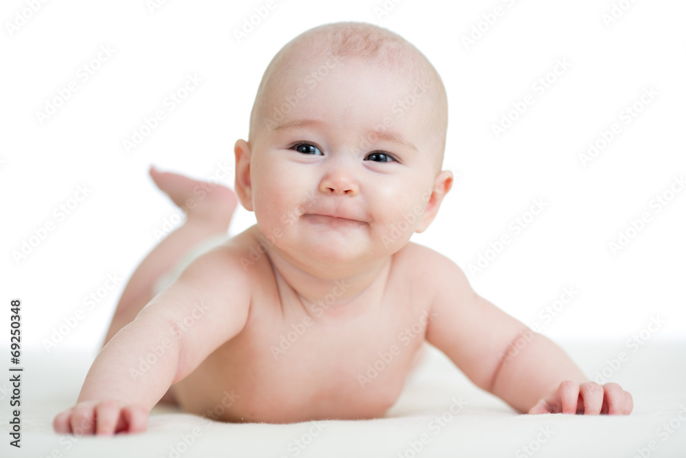 Baby boy isolated lying smilingly Baby boy isolated lying smilingly