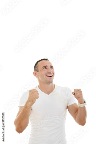 man looking up with a slightly raised arms and clenched fists