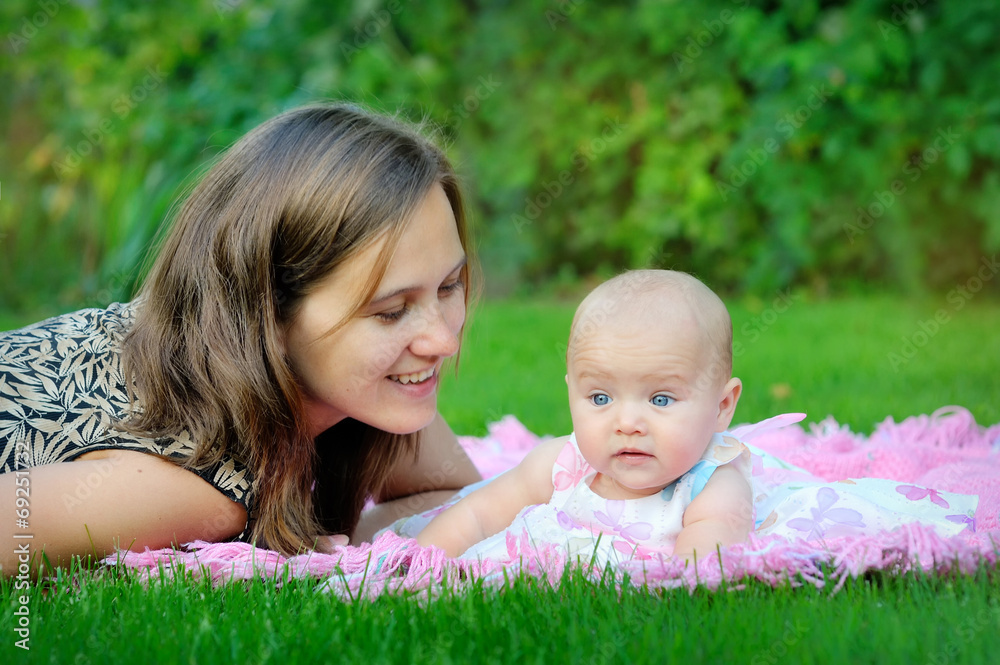 Portrait of happy loving mother and her baby outdoors Portrait of happy loving mother and her baby outdoors