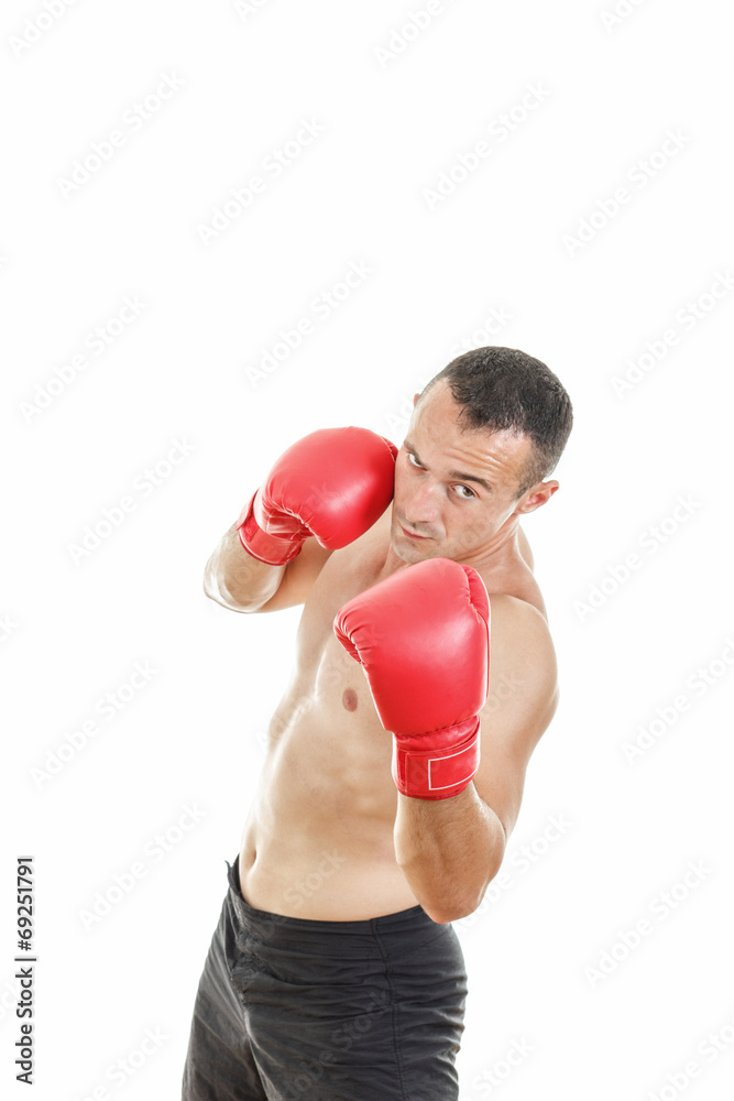 Handsome muscular male boxer ready to fight with boxing gloves Handsome muscular male boxer ready to fight with boxing gloves