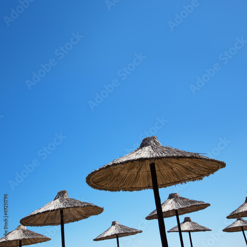 Beach umbrella on a sunny day © chagin
