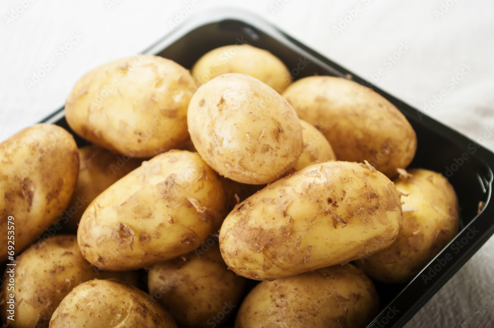 Fresh tasty new potatoes. Selective focus close up Fresh tasty new potatoes. Selective focus close up