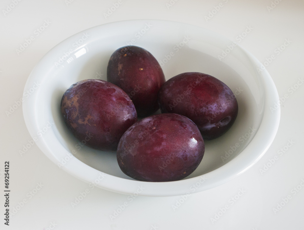 Red plum fruit isolated on white background Red plum fruit isolated on white background