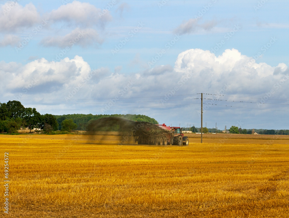 Naklejka premium Tractor on the field.