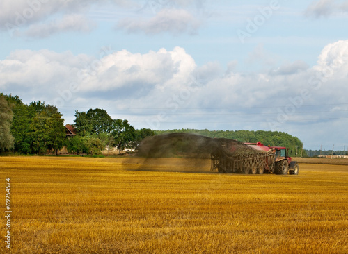 Fotografie Tractor on the field.