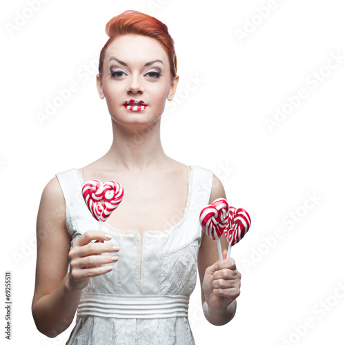 happy red-haired girl holding candy