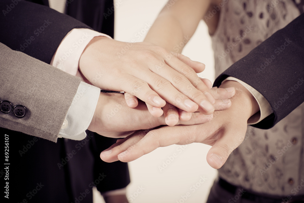 Business group with hands together - teamwork concepts