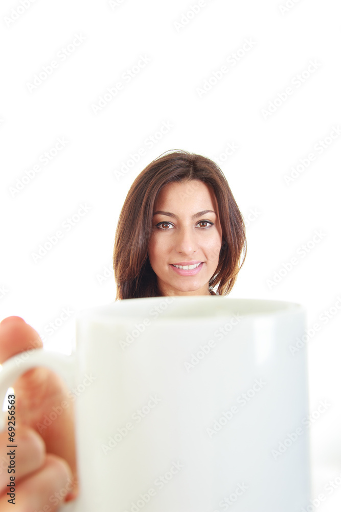 Cup of coffee in hand of pretty young woman