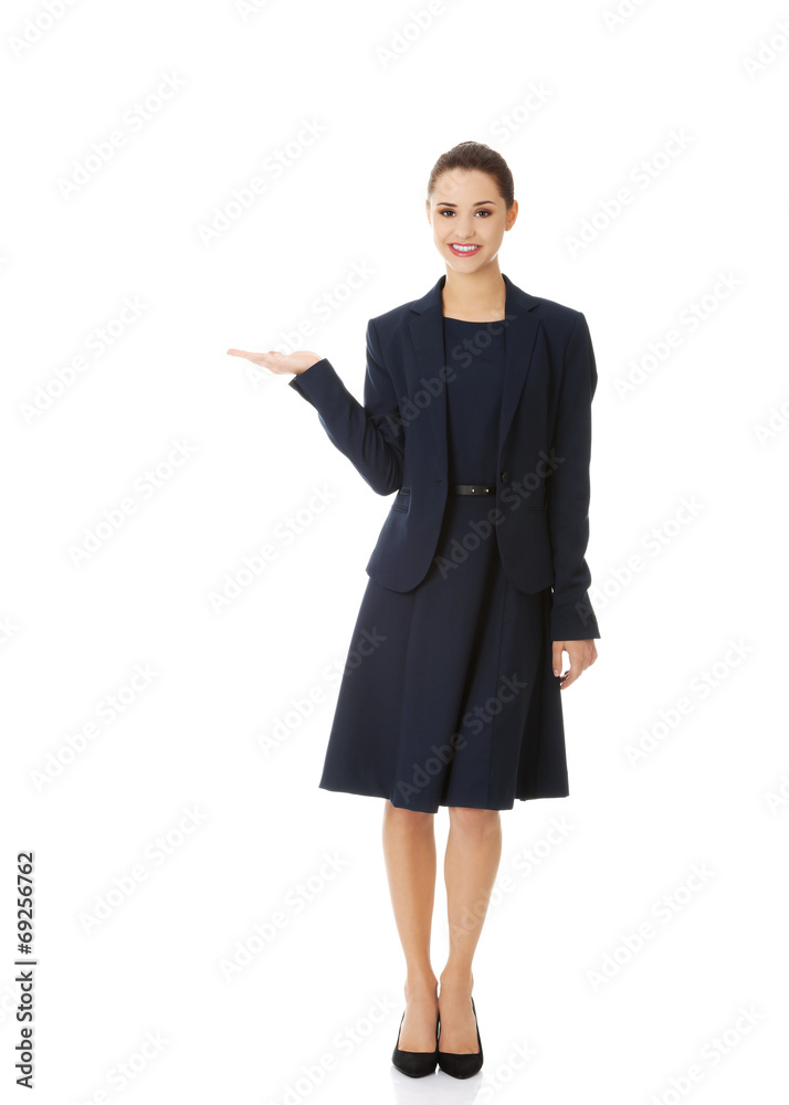Business woman showing something or copyspase Business woman showing something or copyspase