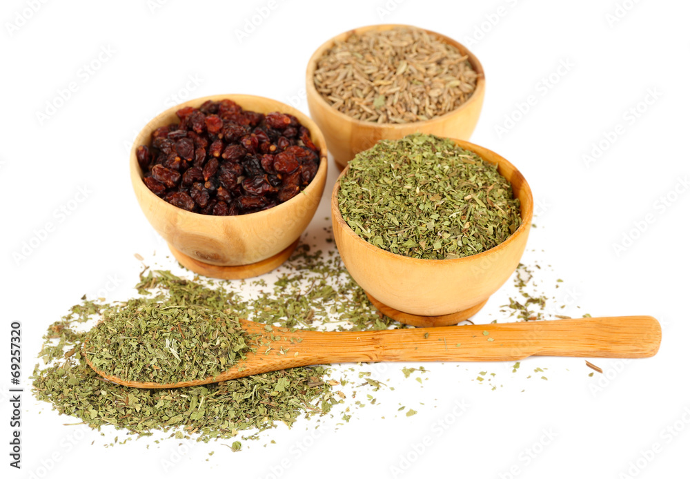 Round wooden bowl and spoon full of seasoning Round wooden bowl and spoon full of seasoning