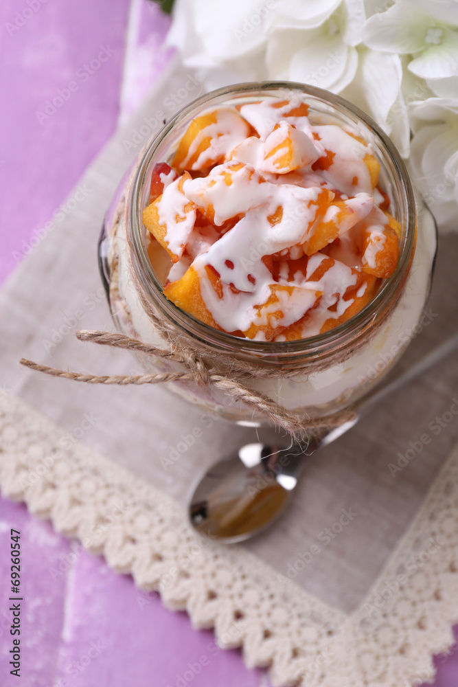 Healthy breakfast - yogurt with fresh peach and muesli served Healthy breakfast - yogurt with fresh peach and muesli served