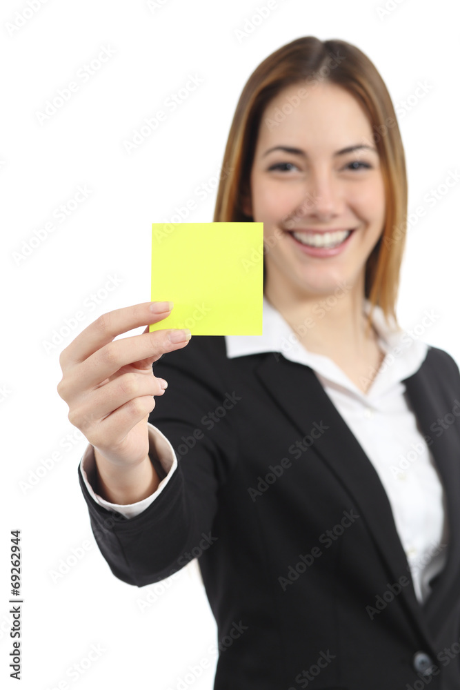 Beautiful businesswoman showing a blank yellow paper note Beautiful businesswoman showing a blank yellow paper note