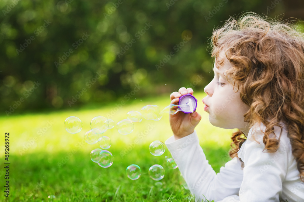 little girl blowing soap bubbles, closeup portrait beautiful cur little girl blowing soap bubbles, closeup portrait beautiful cur