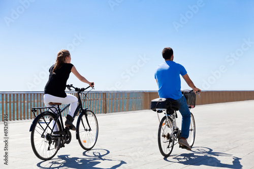 Cyclists on the seaside promenade.