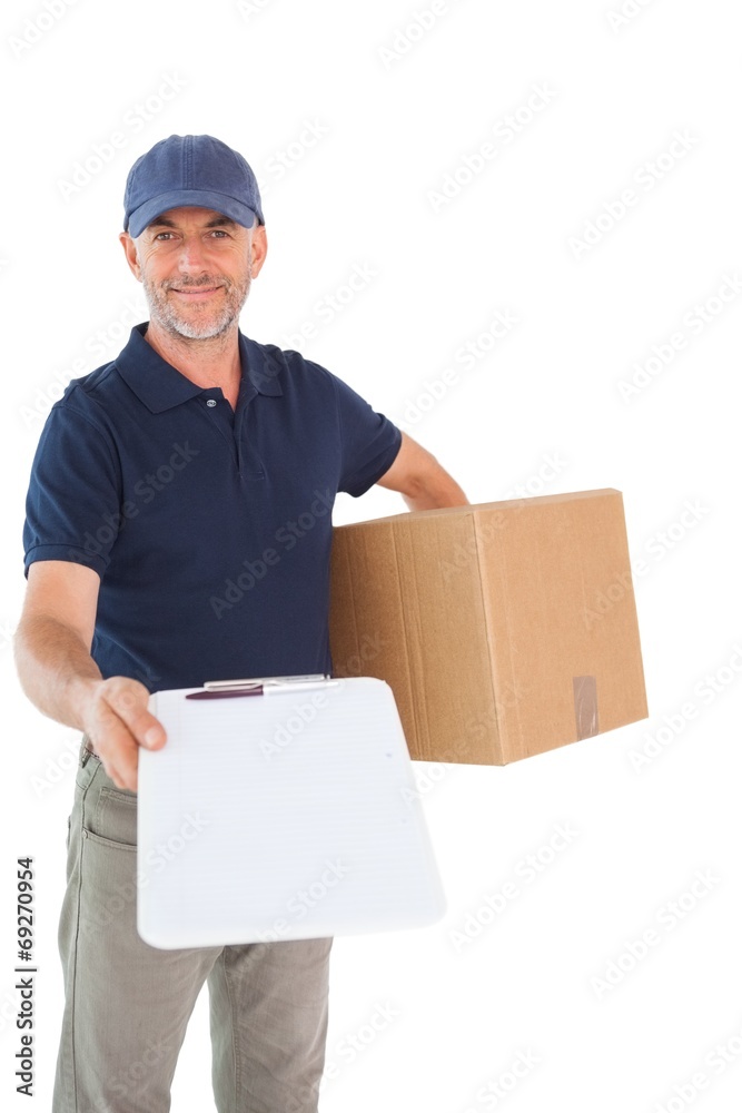 Happy delivery man holding cardboard box and clipboard Happy delivery man holding cardboard box and clipboard