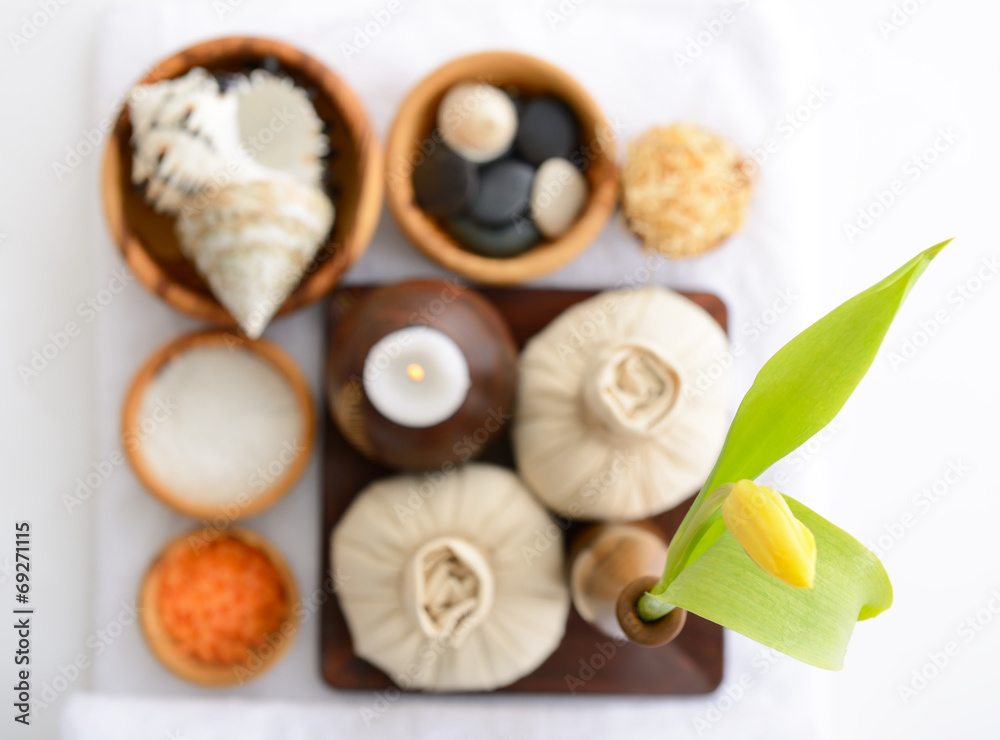 spa still life with spa herbal balls, candlestick, tulip, stones spa still life with spa herbal balls, candlestick, tulip, stones