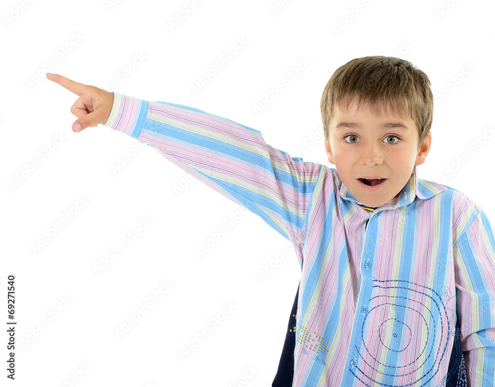 Cute surprise little boy pointing at copyspace, over white backg Cute surprise little boy pointing at copyspace, over white backg