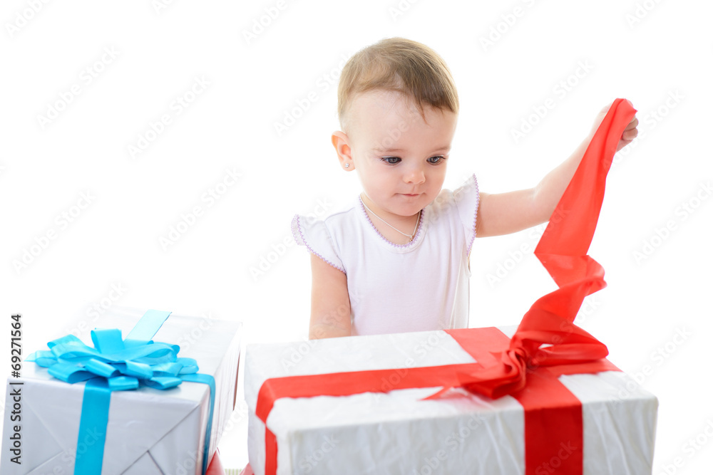 Holidays, baby girl opening box with presents, christmas, birthd Holidays, baby girl opening box with presents, christmas, birthd