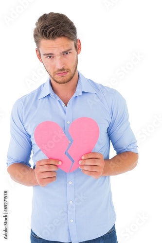 Sad man holding a broken heart © WavebreakmediaMicro