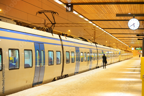 Commuter traing waiting at winter platform
