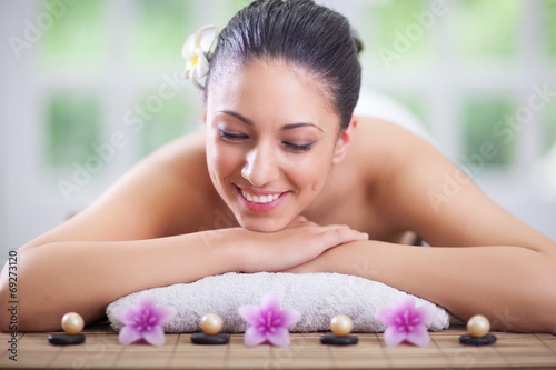  beautiful woman relaxing in spa center