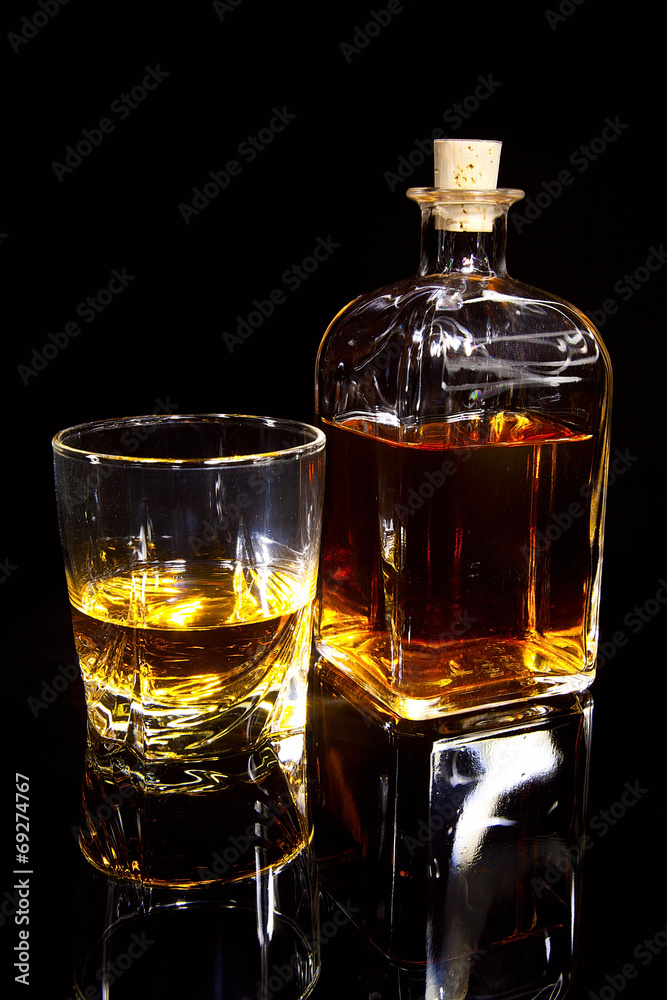 Bottle and glass of whiskey Bottle and glass of whiskey