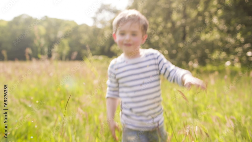 Little Boy Plays With Confetti In Park Little Boy Plays With Confetti In Park