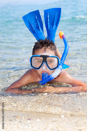 boy in the sea with diving mask