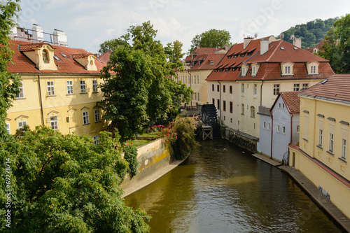 Prague river with waterwheel