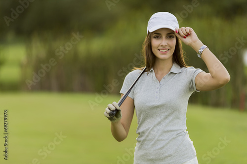 Young woman playing golf