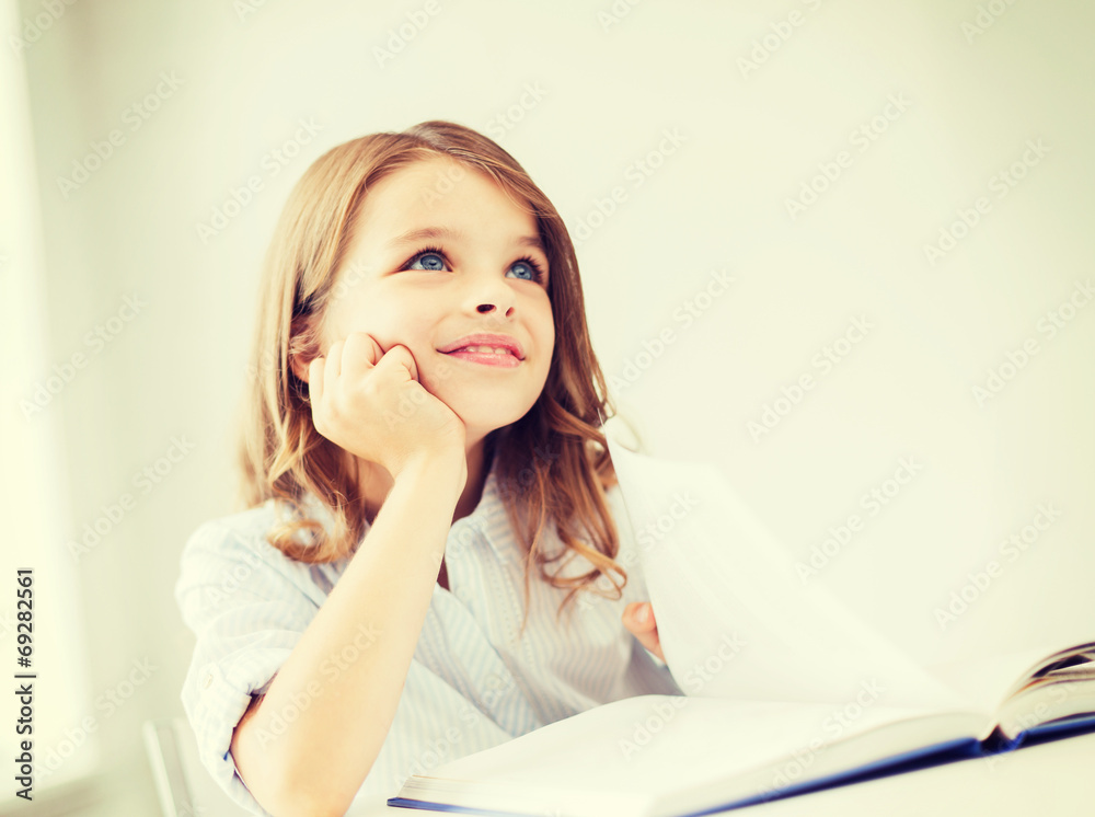 student girl writing in notebook at school student girl writing in notebook at school