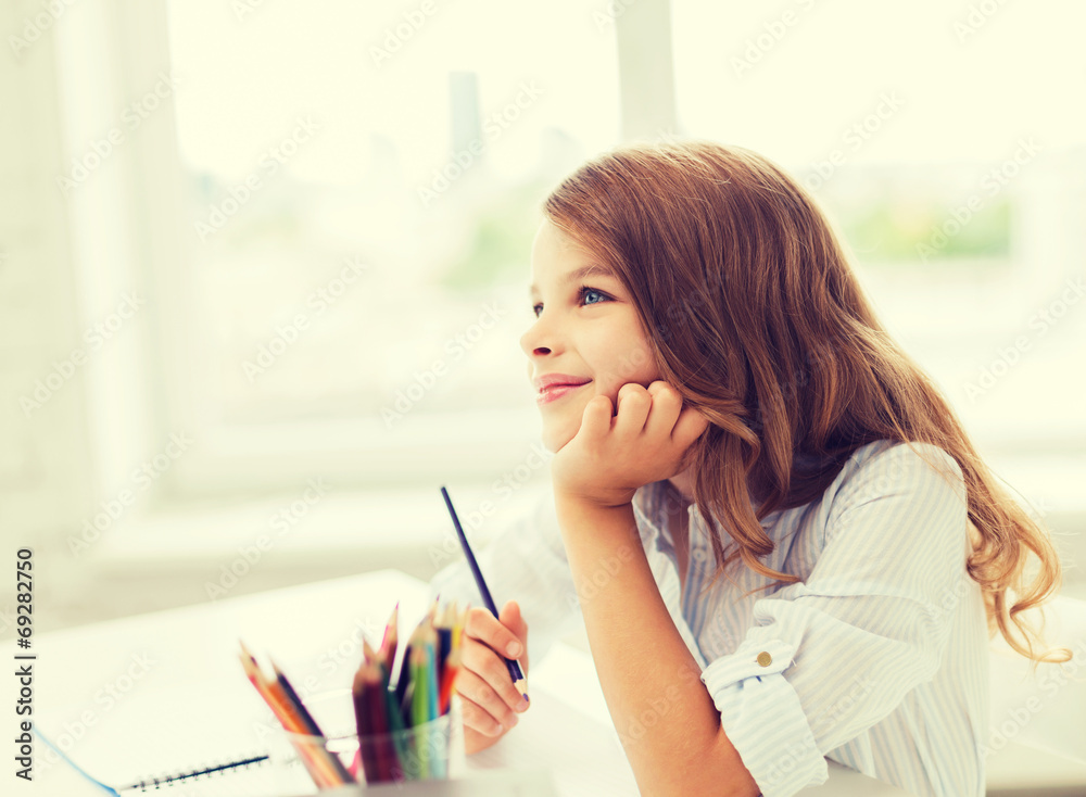 little student girl drawing and dreaming at school little student girl drawing and dreaming at school