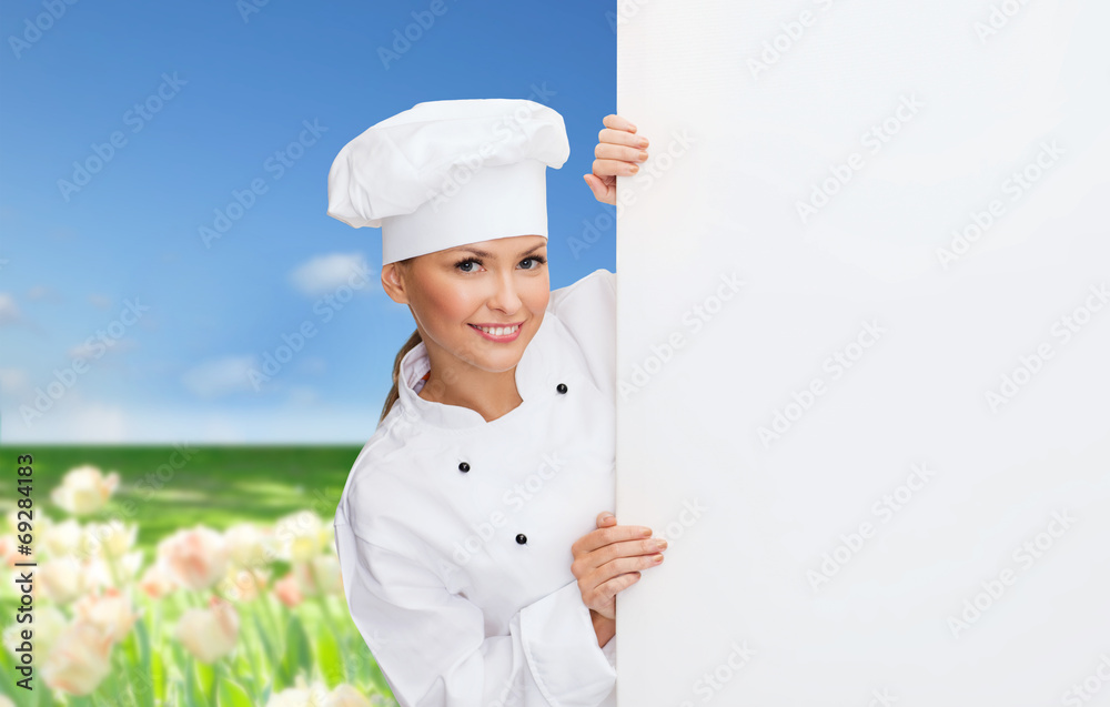 smiling female chef with white blank board smiling female chef with white blank board