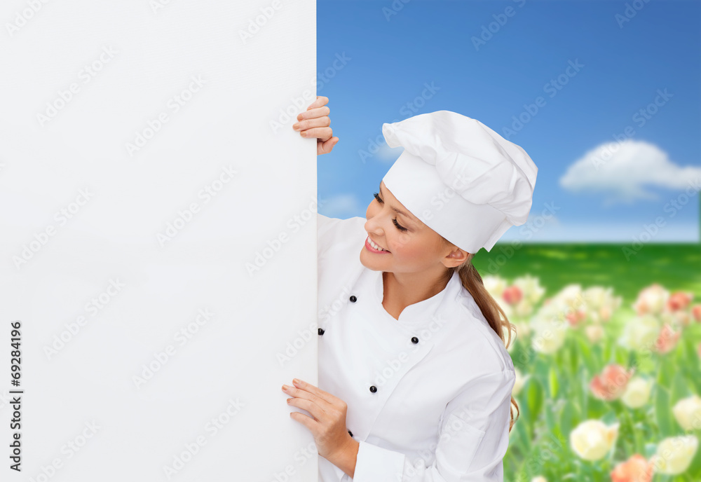 smiling female chef with white blank board smiling female chef with white blank board