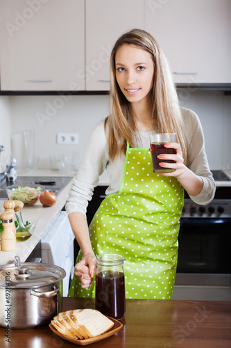 woman in apron with fresh quass photo