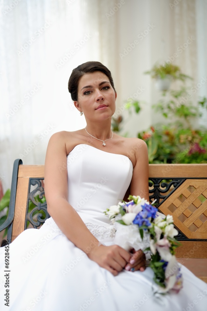 Portrait of beautiful bride with a bunch of flowers Portrait of beautiful bride with a bunch of flowers