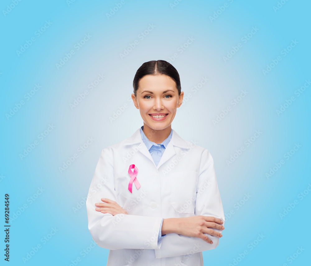 smiling female doctor with cancer awareness ribbon