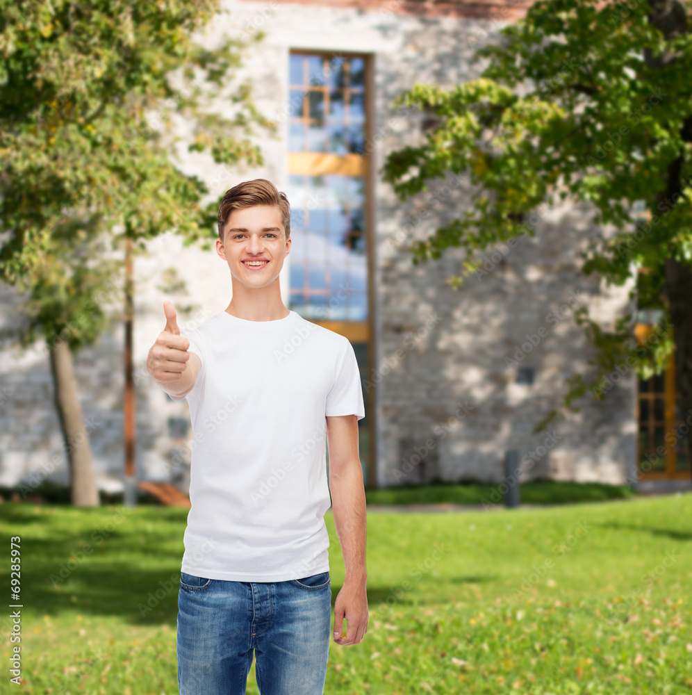 smiling man in white t-shirt showing thumbs up smiling man in white t-shirt showing thumbs up