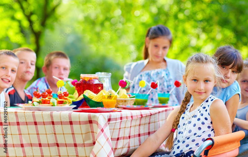 happy kids around picnic table happy kids around picnic table