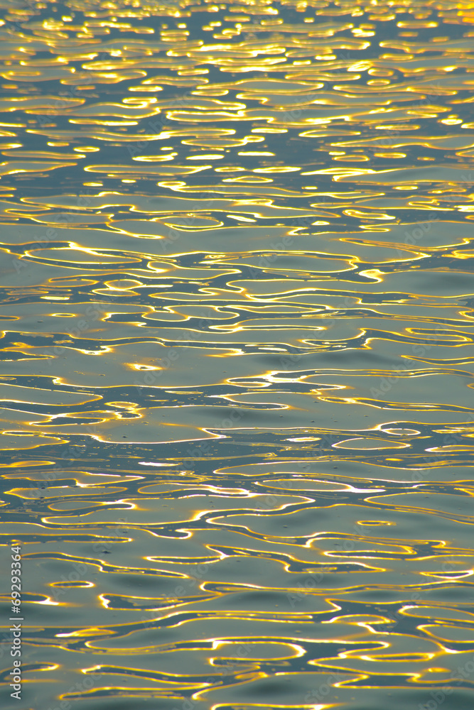 Golden sunlight reflection in the morning on the sea Golden sunlight reflection in the morning on the sea
