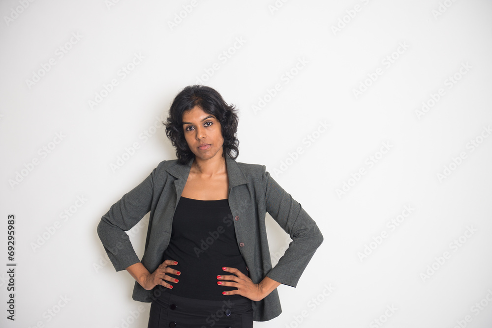 indian business woman with serious look and plain background indian business woman with serious look and plain background