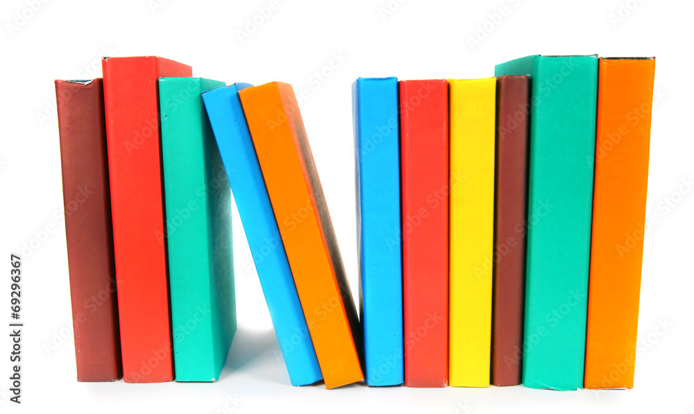 Multi-coloured books. On white background. Multi-coloured books. On white background.
