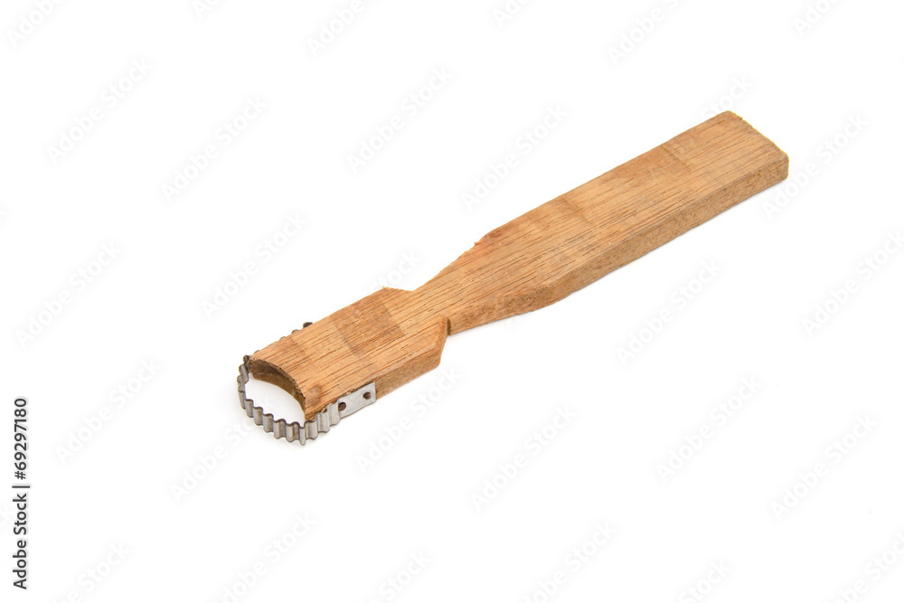 Coconut grater on the white background Coconut grater on the white background